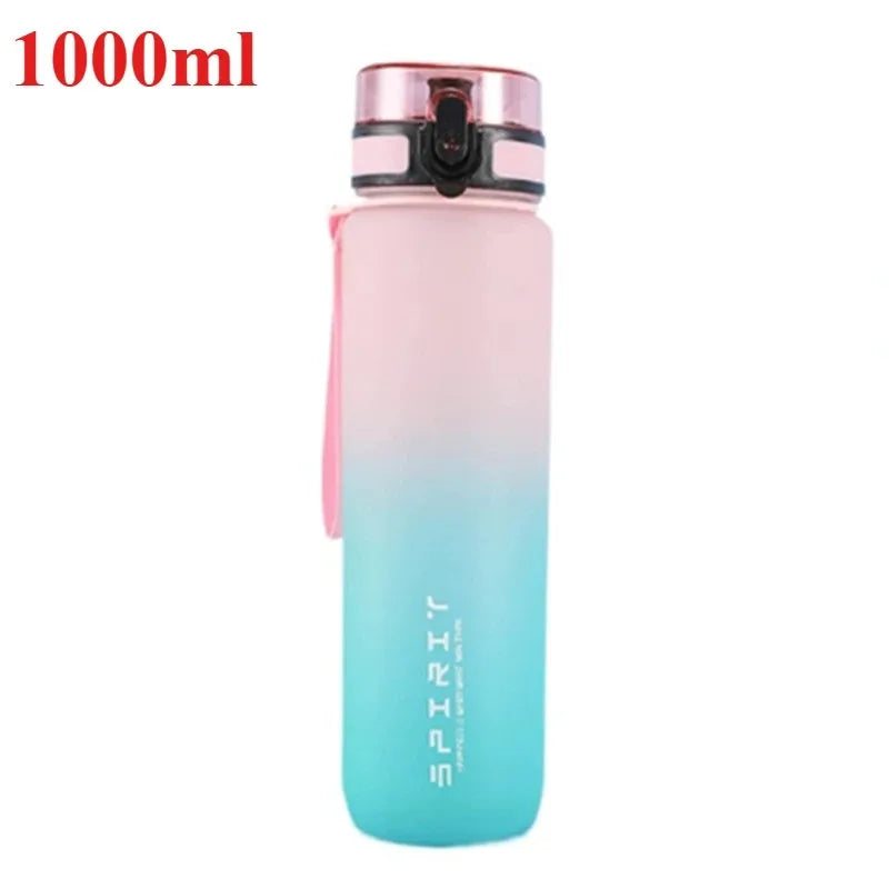 Gradient pink to blue water bottle with 'SPIRIT' branding on a white background
